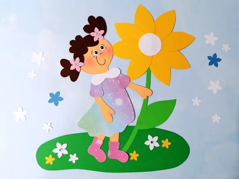 Mädchen mit großer Blume aus Bastelpapier
