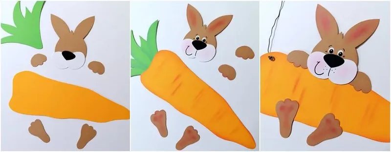 Ein Hase mit einer Möhre aus Bastelpapier wird zusammengeklebt
